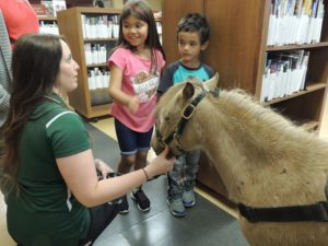 Kids learning about therapy horses.