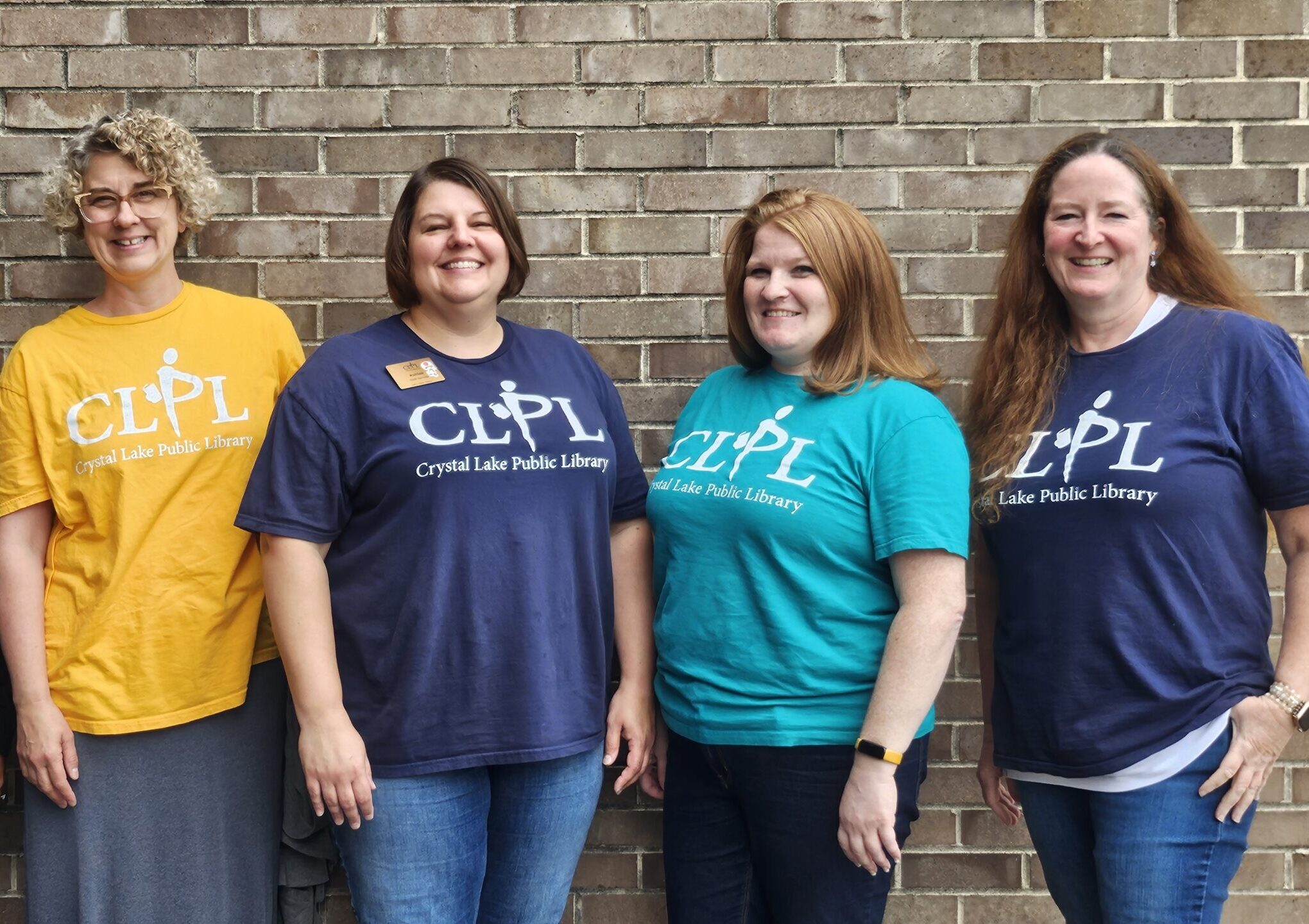 picture of 4 CLPL staff members that provide school outreach services